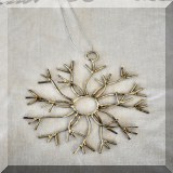 D107. Metal snowflake - $6 